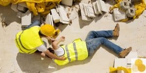 Workers' compensation worklace injury scene of employee helping injured colleague